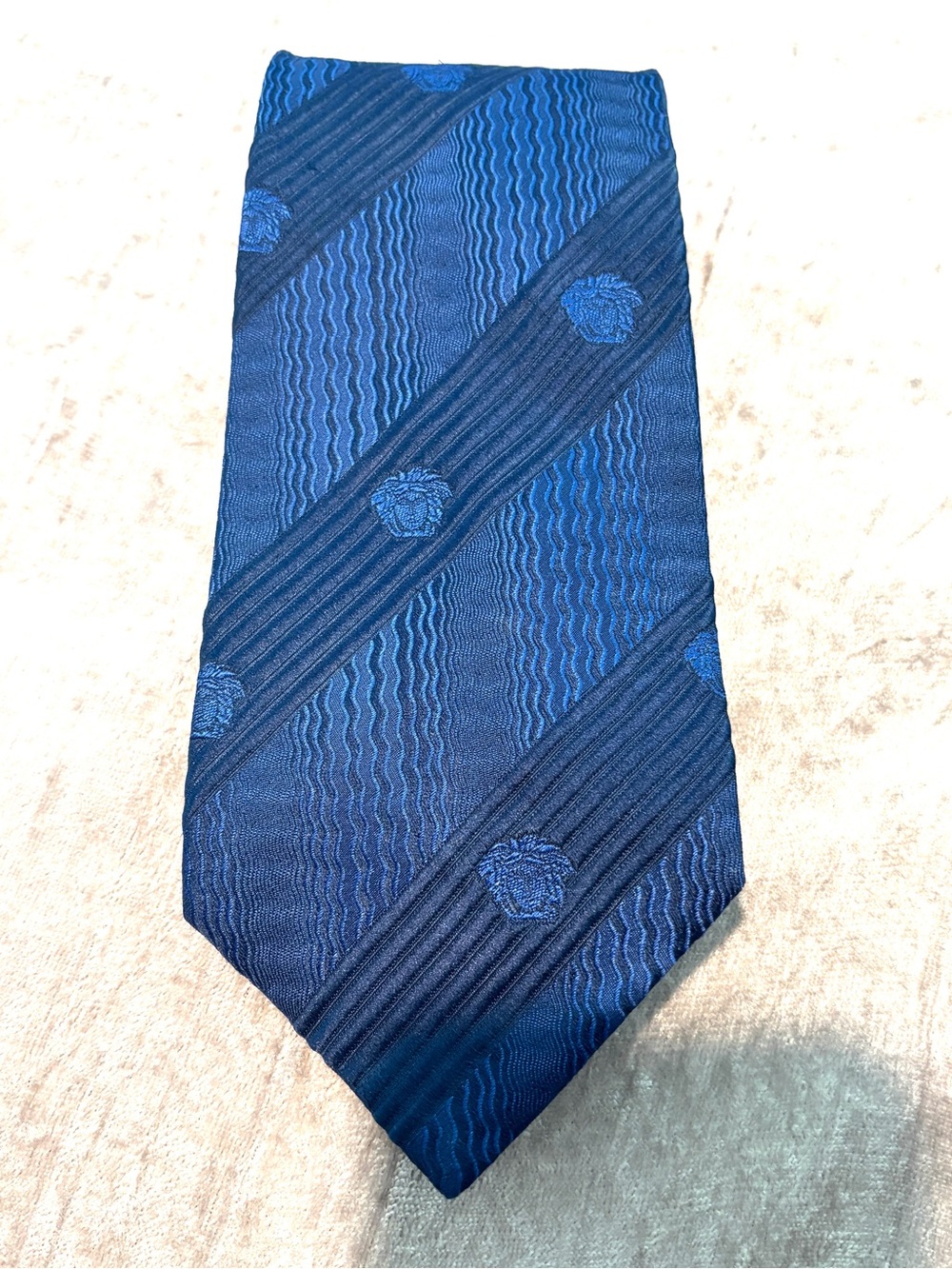 Newer Vintage Versace- Men's neck tie. All Silk. Royal Blue w/Medusa head